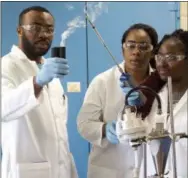  ?? BILL RETTEW - DIGITAL FIRST MEDIA ?? Current WCU Master of Public Health Graduate Research Assistants Chijioke Nnaka, left, Ifeoma Chikelu and Whitney Fahnbulleh are pictured working in the lab of Drs. Neha Sunger and Lorenzo Cena.