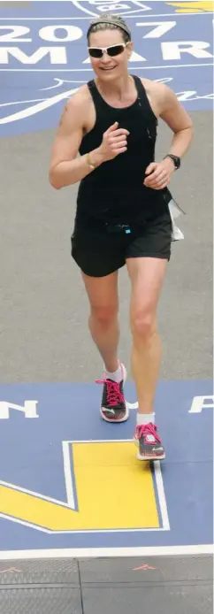  ?? ?? LEFT Dr. Rose Zacharias crosses the line at the 2017 Boston Marathon