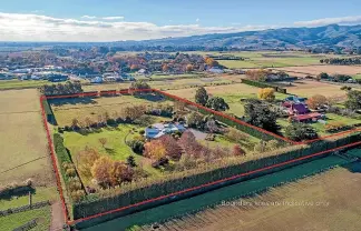  ??  ?? This home on a private 3.0002ha rear section boasts three paddocks, an orchard, potager garden and establishe­d trees.