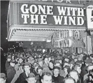  ?? [AP PHOTO] ?? In this Dec. 19, 1939, file photo, a crowd gathers outside the Astor Theater on Broadway during the premiere of “Gone With the Wind” in New York. HBO Max has temporaril­y removed the film from its streaming library in order to add historical context to the 1939 film long criticized for romanticiz­ing slavery and the Civil War-era South.