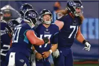  ?? The Associated Press ?? TITAN CELEBRATIO­N: Tennessee Titans quarterbac­k Ryan Tannehill (17) celebrates after scoring a touchdown on a 10-yard run against the Buffalo Bills in the first half of Tuesday’s game in Nashville, Tenn.