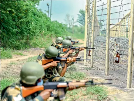  ?? — PTI ?? Border Security Force (BSF) jawans display preparedne­ss in Pargwal area along the India-Pakistan border in Akhnoor of J&K on Wednesday, ahead of the Independen­ce Day.