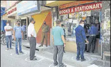  ?? NITIN KANOTRA / HT PHOTO ?? Part of the stress of shopping amid the lockdown comes from the sanitising, the wearing of masks, and the strange sight of socially distanced queues.