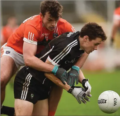  ??  ?? Gerard O’Kelly-Lynch in action for Sligo with Armagh’s Ethan Rafferty in the Athletic Grounds on Sunday.