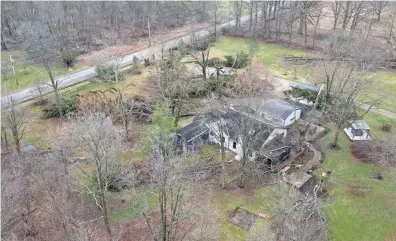  ?? ADAM CAIRNS/COLUMBUS DISPATCH ?? Drone footage shows the path of a potential tornado as it passed over Pataskala, shearing off trees and causing damage to numerous properties.
