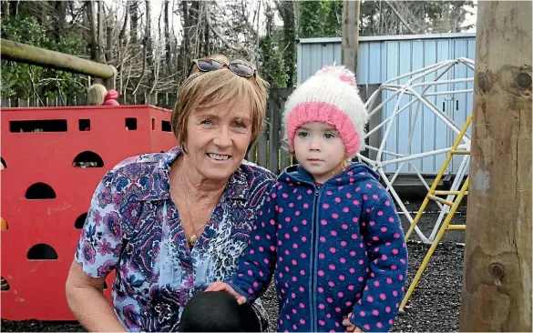  ??  ?? Have house, will travel: First Five Childcare Centre supervisor Jenni Mason, with Millie Watson, 2, hopes to move the centre’s building on to empty land in Porirua.