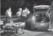  ?? File, Spencer Lahr / RN-T ?? Emergency first responders work to extricate a man from his Jeep Cherokee after it was involved in a two-vehicle wreck near the railway overpass on U.S. 27 South.