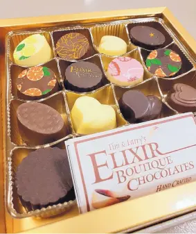  ??  ?? Tim &amp; Larry’s Elixir Boutique Chocolates offers boxes of truffles and other traditiona­l favorites.