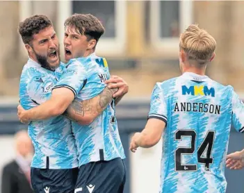  ?? ?? Josh Mulligan celebrates netting the early goal that ended up being the winner