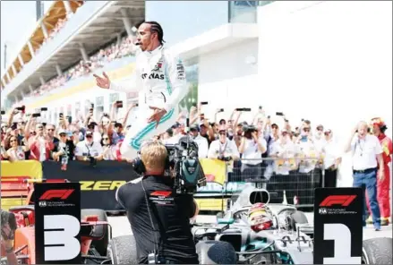  ?? CHARLES COATES/GETTY IMAGES/AFP ?? Race winner Lewis Hamilton of Great Britain and Mercedes GP celebrates in parc ferme after the F1 Grand Prix of Canada at Circuit Gilles Villeneuve on Sunday in Montreal, Canada.