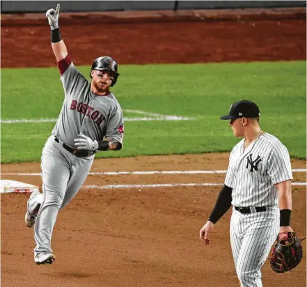  ?? Bill Kostroun / Associated Press ?? Christian Vazquez strikes the final blow for the Red Sox on Tuesday, homering in the fourth inning as they held off the Yankees 4-3 to wrap up their AL Division Series in four games. The Red Sox will play the Astros in the ALCS starting Saturday.