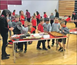  ??  ?? Lamlash Primary pupils take a keen interest in the displays.