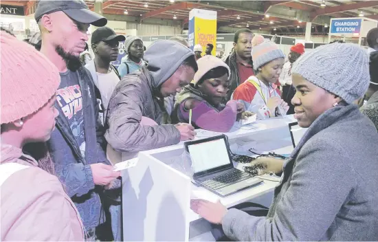  ?? Pictures: Reuters ?? GETTING GOING. Young people looking for jobs and career advice at Gauteng’s Youth Jobs, Careers and Entreprene­urship Expo outside Johannesbu­rg last month.