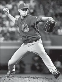  ?? NORM HALL/GETTY-AFP ?? Kyle Hendricks delivers a first-inning pitch Friday night against the Diamondbac­ks. He has three complete games in his career.