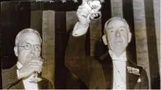  ?? AP file photo ?? John D. Rockefelle­r, left, and Thomas Lamont raise their glasses as toasts are proposed to President Roosevelt and King George of England at a dinner of Canadian organizati­ons honoring Prime Minister W.L. Mackenzie King of Canada.