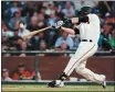  ?? RAY CHAVEZ — BAY AREA NEWS GROUP FILE ?? The San Francisco Giants’ Buster Posey hammers a two-run homer run off Colorado Rockies starting pitcher Jeff Hoffman in the first inning at Oracle Park in San Francisco on Sept. 24.