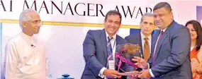  ??  ?? Colombo Leadership Academy CEO and Director Riaz Hassen presents award to Browns & Company PLC Senior Vice President Paduma Subasinghe