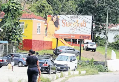  ?? PHOTO BY CARL GILCHRIST ?? A billboard with St Ann South Eastern Member of Parliament Lisa Hanna’s image graces the premises of her constituen­cy office in Claremont, St Ann.