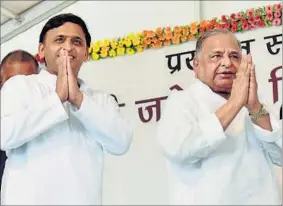  ??  ?? SP chief Mulayam Singh Yadav (right) with chief minister Akhilesh Yadav at a function in Lucknow. The party’s best bet is its CM as critics have always appreciate­d his clean image. HT FILE