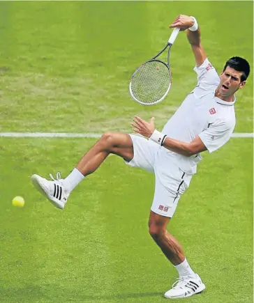  ??  ?? NO PRISONERS: Novak Djokovic stretches to smash the ball during his match against Florian Mayer