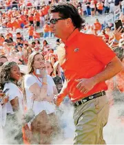  ?? [PHOTO BY NATE BILLINGS, THE OKLAHOMAN] ?? Oklahoma State coach Mike Gundy and his staff are staying busy with bowl game preparatio­ns and a hectic recruiting period as the new early signing date of Dec. 20 approaches.