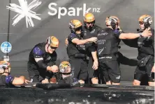  ?? Gilles Martin-Raget / AFP via Getty Images ?? Crew members of Team New Zealand celebrate their victory against Luna Rossa in 36th America's Cup in Auckland.