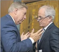  ?? [CAROLYN KASTER/THE ASSOCIATED PRESS] ?? Senate Budget Committee members Lindsey Graham, R-S.C., left, and Bob Corker, R-Tenn., talk Tuesday before the panel advanced a sweeping tax package to the full Senate, handing GOP leaders a victory.