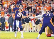  ?? JACK DEMPSEY/ASSOCIATED PRESS FILE ?? Peyton Manning, shown passing for Denver in 2014, has said this upcoming season is not the right time to consider an NFL TV analyst’s position.