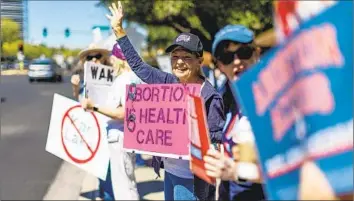  ?? Gina Ferazzi Los Angeles Times ?? ABORTION could sway the vote in the crucial state. Dozens of rallies have been held to decry the state high court’s approval last week of an 1864 near-ban, with protesters emphasizin­g: “Remember in November.”