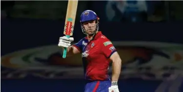  ?? Courtesy: IPL ?? ↑ Mitchell Marsh of Delhi Capitals celebrates after scoring a fifty against Rajasthan Royals in their IPL match.