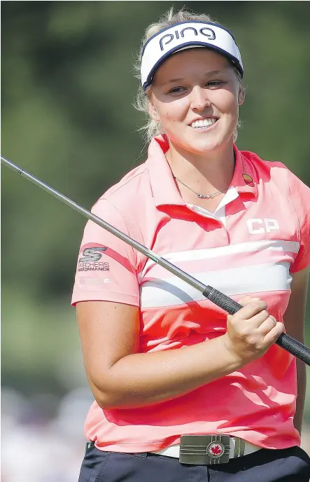  ?? GREGORY SHAMUS/ GETTY IMAGES ?? Brooke Henderson reacts after missing an eagle putt on the 18th green during Sunday’s final round at the KPMG Women’s PGA Championsh­ip in Olympia Fields, Ill.