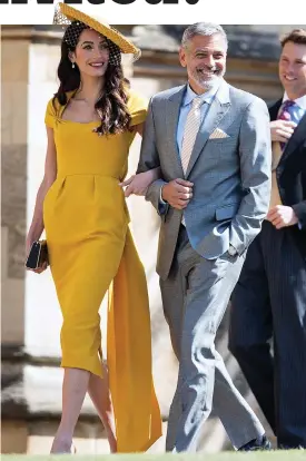  ??  ?? Golden glamour: Amal Clooney arm in arm with George