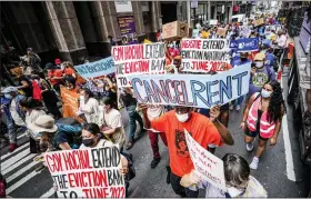  ?? ASSOCIATED PRESS FILE PHOTO ?? Housing activists march across town toward New York Gov. Kathy Hochul’s office, calling for an extension of pandemic-era eviction protection­s, on Aug. 31, 2021, in New York. Prices paid by U.S. consumers jumped in December 2021 compared to a year earlier, the latest evidence that rising costs for food, gas, rent and other necessitie­s are heightenin­g the financial pressures on America’s households.