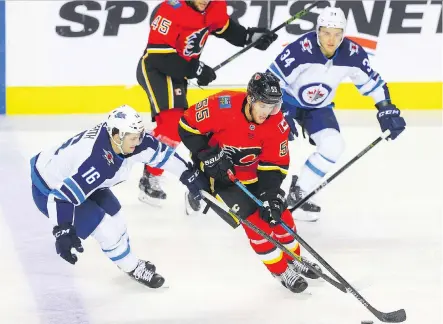  ?? AL CHAREST ?? Former Carolina Hurricane Noah Hanifin has made a smooth transition playing with veteran Travis Hamonic on the Flames blueline.