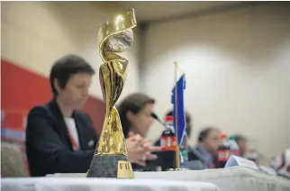  ?? DARRYL DYCK/THE CANADIAN PRESS ?? The FIFA Women’s World Cup trophy is on display as FIFA and Canadian Soccer Associatio­n officials attend a news conference in Vancouver on Thursday.