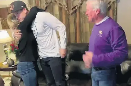  ?? NFL VIA ASSOCIATED PRESS ?? Joe Burrow celebrates Thursday night with his parents in The Plains, Ohio, after the Cincinnati Bengals took him to start the NFL draft.