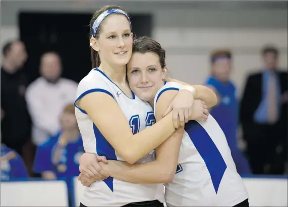  ?? RICHARD LAM — UBC ATHLETICS ?? UBC Thunderbir­ds’ fifth-year seniors Kyla Richey (left) and Rayel Quiring share a hug after being honoured during a recent seniors’ night at War Memorial Gymnasium. They will play their final homes games for UBC Friday and Saturday at the Canada West...