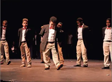  ?? Spencer Lahr / RN-T ?? The Anna K. Davie Distinguis­hed Gentlemen perform their routine to Tupac Shakur’s “Dear Mama” at the Rome High auditorium for the Black History Month performanc­e Wednesday. The program was titled “Moguls, Movies and Music.”