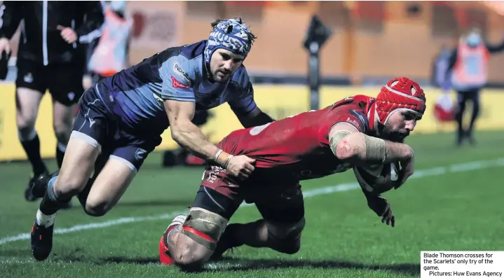  ??  ?? Blade Thomson crosses for the Scarlets’ only try of the game.
Pictures: Huw Evans Agency