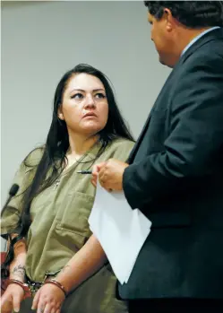  ?? LUIS SÁNCHEZ SATURNO/THE NEW MEXICAN ?? Ashley Roybal, with her attorney Michael Jones, was sentenced Thursday to more than 20 years in prison for her role in the 2011 pickax family slayings in El Rancho.