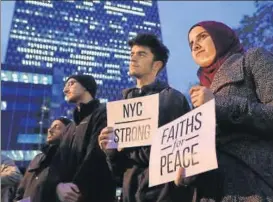  ?? AFP ?? People take part in a vigil for those killed in the October 31 terror attack in New York City.