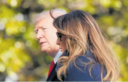  ?? Picture / AP ?? Donald and Melania Trump have said little about their marriage, so small gestures are deciphered.