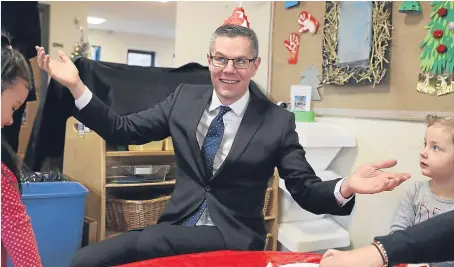  ?? Picture: PA. ?? Finance Secretary Derek Mackay met children at Lennoxtown Nursery in Lennoxtown, East Dunbartons­hire, yesterday as ministers tabled councils’ new funding deal.