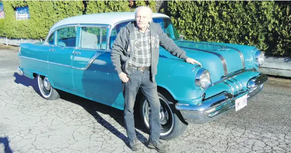  ?? PHOTOS: ALYN EDWARDS ?? George Perkin shows off the 1955 Pontiac that he restored. The mechanic’s family had owned a similar one previously, mostly to haul home groceries.