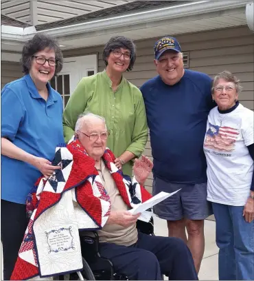  ?? SUBMITTED PHOTO ?? Sgt. John Homcha of Exeter Township received a Quilt of Valor during a ceremony held at his residence on Oct. 11. With him are, from left, daughters Michele Green and Marie Kaminskas, son Michael Homcha and quilt maker Patricia Buzzard.