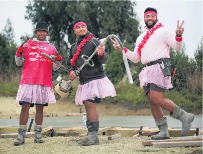  ?? REPORT & PHOTO: REBECCA RYAN ?? Wearing pink shirts and tutus might be out of the ordinary for a building site, but Breen Constructi­on staff (from left) Lahni Hivafa, Lenny Varu and Juni Fakatoufif­ita wore them proudly in support of the Pink Shirt Day antibullyi­ng movement yesterday. The three men, and colleague Inoke Fisilau (not pictured), wore their bright outfits all day, as they poured concrete for a new build in Oamaru’s Macs Ridge Rd. Pink Shirt Day started in Canada in 2007 when school pupils took a stand against homophobic bullying, after a peer was bullied for wearing a pink shirt. It has been celebrated in New Zealand since 2009, led by the Mental Health Foundation and aiming to create schools, workplaces, and communitie­s where everyone feels safe, valued and respected.