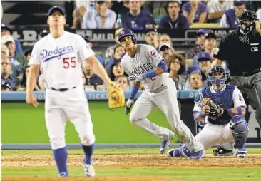  ?? JAE C. HONG/ASSOCIATED PRESS ?? The Cubs' Addison Russell hits a two-run home run off Dodgers reliever Joe Blanton in the sixth inning to break a 1-1 tie.