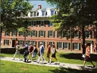  ?? Hearst Connecticu­t Media file photo ?? Visitors walk in front of Edwin McClellan Hall on Yale University’s Old Campus during a Yale University Visitor Center walking tour. Just under 22 percent of Connecticu­t seniors who sent SAT scores sent them to Ivy League institutio­ns. Connecticu­t came in at No. 13 out of the 50 states for its rate of seniors who applied to Ivy League schools in 2022.