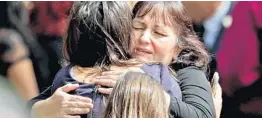  ?? JOHN MCCALL/STAFF PHOTOGRAPH­ER ?? Two women embrace after the funeral Monday of Alaina Petty at The Church of Jesus Christ of Latter-day Saints in Coral Springs.