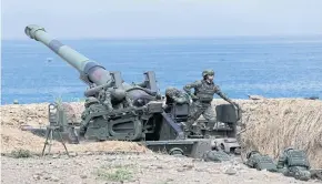  ?? REUTERS ?? Female soldiers of an artillery unit in Pingtung, Taiwan, take part in a 2019 live-fire military exercise that simulated a China’s People’s Liberation Army invasion of the island.